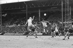 Paul Elliott gets his head to the ball