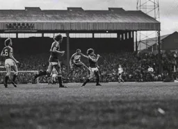 Brian Horton fires a shot past Bryan Robson