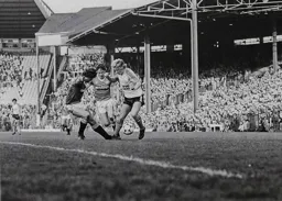 Paul Walsh takes on a couple of defenders