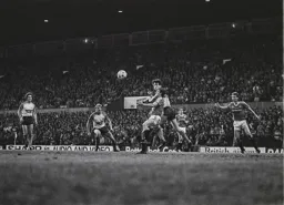 Trevor Aylott gets his head to the ball first