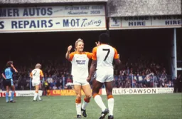 Ricky Hill is congratulated by Paul Walsh after opening the scoring