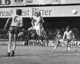 Paul Walsh sends a header towards goal