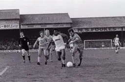 Ricky Hill tries to take the ball from Trevor Peake