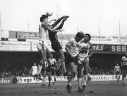 Trevor Aylott heads the ball away from Albion keeper Paul Barron