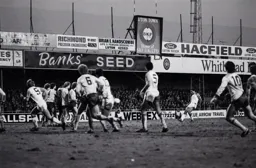 Brian Stein hammers the ball into the Arsenal wall