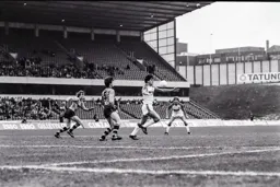 Trevor Aylott controls the ball in front of small crowd