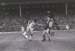 Trevor Aylott turns the Villa defender