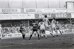 Trevor Aylott gets to the ball first