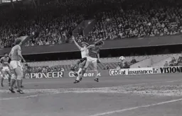 Brian Stein beaten to the ball by Russell Osman