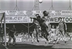 Paul Elliott tries to get to the corner