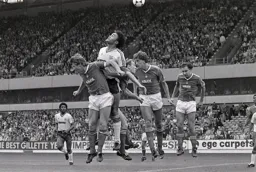 Paul Elliott above the Reds defence