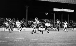 Ricky Hill gets in a low header