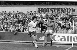 David Moss get in his cross before a tackle from Steve Perryman