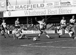 Brian Stein in a race to the ball