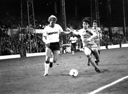 Tim Breacker moves past the United defender