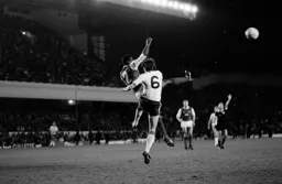 Mal Donaghy challenging in the Arsenal box