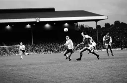 Steve Foster on his debut in a battle with Paul Mariner