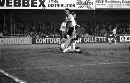 David Moss has the ball taken by the keeper