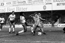 Ricky Hill gets in first against Stuart Pearce