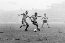 Ricky Hill rounds the defender