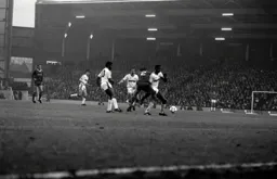 Mitchell Thomas holds off the Liverpool player