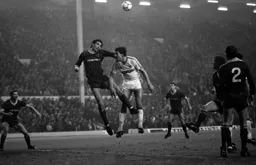 Mick Harford goes in with Alan Hansen