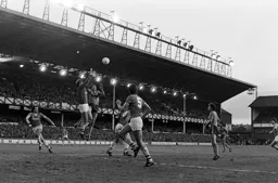 Mick Harford rises with Neville Southall