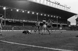Mick Harford watches Neville Southall fall to the floor