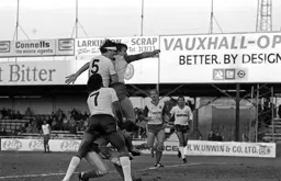 Steve Foster up with the defender