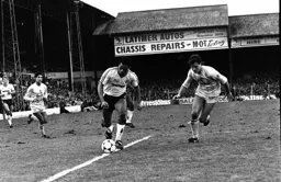 Brian Stein glides past Glen Hoddle