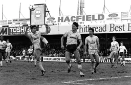 Mick Harford watches on as Chris Hughton clears
