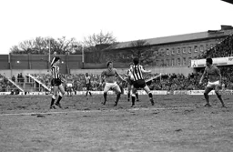 Peter Nicholas fights for the ball in midfield
