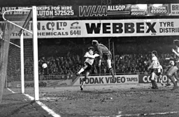 Mick Harford beats the keeper but not the post