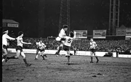 Mick Harford clashes with the Watford defender