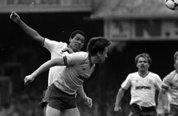 Brian Stein gets his head to the ball