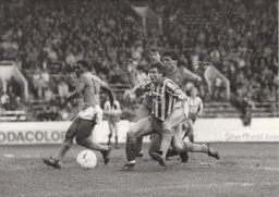 Mick Harford goes for goal