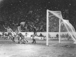 Mick Harford wheels away after scoring