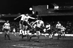 Steve Foster challenges the Hornets keeper