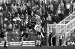 Peter Nicholas feels the full force of a Rangers defender