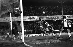 Ricky Hill launches to head the ball