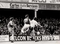 Mick Harford and Emeka Nwajiobi shield the ball from West Ham`s Alvin Martin