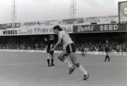 Mick Harford turns to celebrate