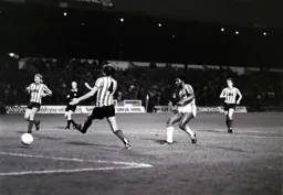 Ricky Hill tries to slot the ball home