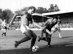 Tim Breacker gets past Gary Briggs to deliver a cross