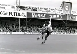 Mick Harford’s effort goes wide