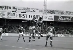Mick Harford wins another header