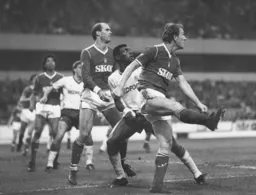 Mitchell Thomas looks on as Ian Bowyer clears the ball for Forest