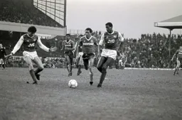 Brian Stein tries to get past Viv Anderson