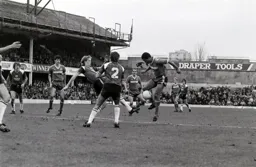 Brian Stein takes the ball from Mark Wright