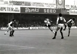 Mick Harford blasts in a shot